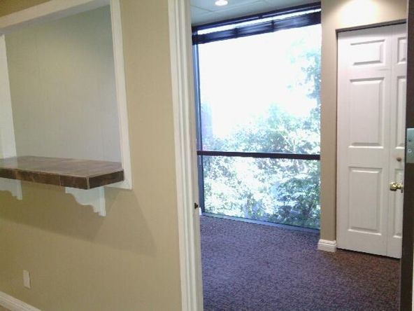 Ground floor office with beautiful tile entry and reception. Several uses.